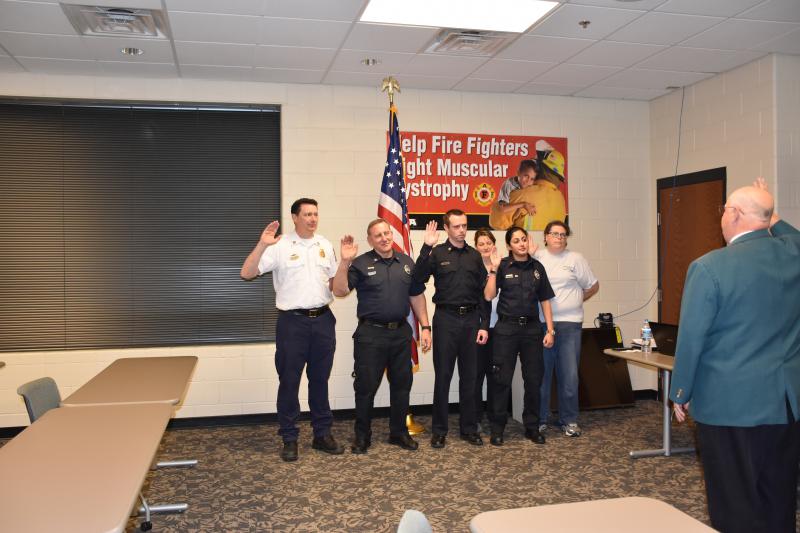 President Roth Jr. swears in some of the Board of Directors