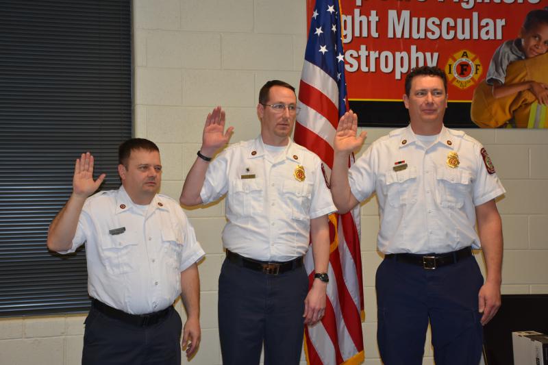 Lt Dan Poulin, Assistant Chief Scott Lindberg and Chief Matt Kenworthy take the oath of office.