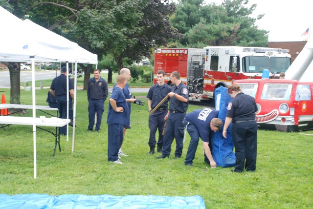 Setting up tents for the Open House.