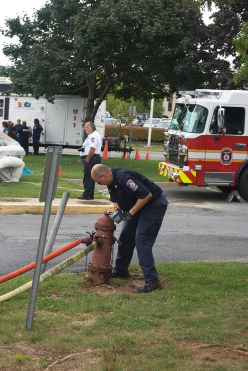 Arthur Rabeau opens the hydrant for the Junior Firefighter Challenge