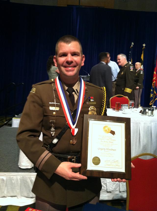 Police Officer III & GVFD EMT Greg Woodman receives the Bronze Medal of Valor 