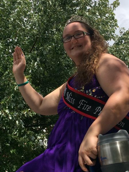 2013-2014  MCVFRA Miss Fire Prevention Ambassador Emily Moyers practice her royal wave prior to the start of the parade.